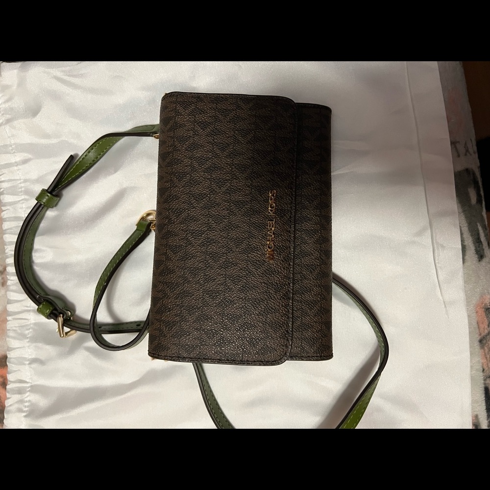 Michael Kors phone wallet with crossbody strap.